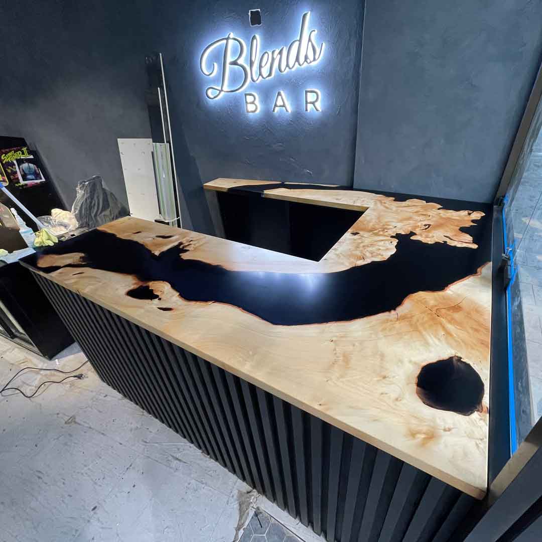 Unique Bar top Epoxy River Paneling (similar to Marblo Resin) and Signage by Goat Works